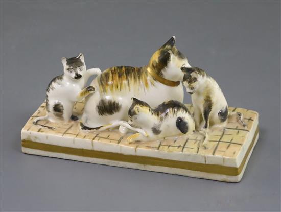 A Rockingham porcelain group of a cat and three kittens, c.1830, L. 11cm, restored